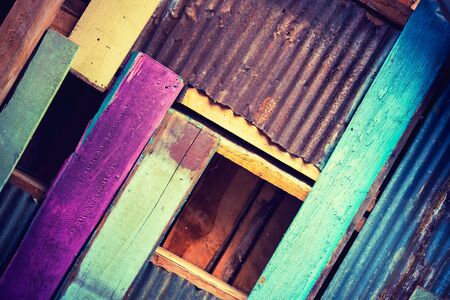 Rusty metal with colour wood for background and textureの写真素材