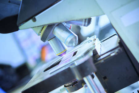 close up of microscope lens in laboratory hospital