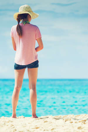 portrait of Asia young woman standing on the beachの写真素材