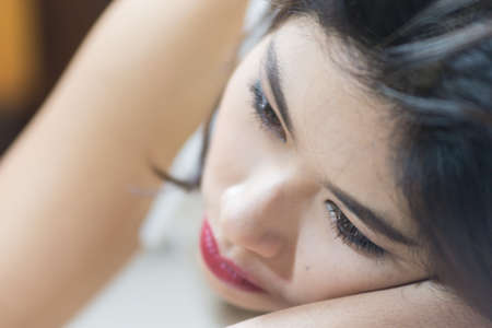 close up Asia women face lying on floor, beauty conceptの写真素材