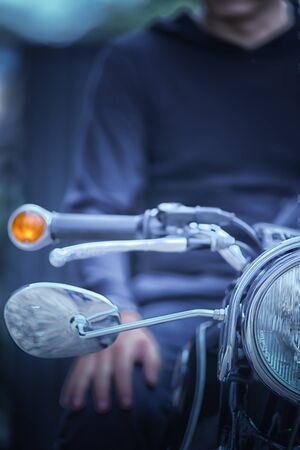 the Biker man sitting on his motorcycle, vintage effect