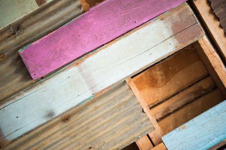 Rusty metal with colour wood for background and textureの写真素材