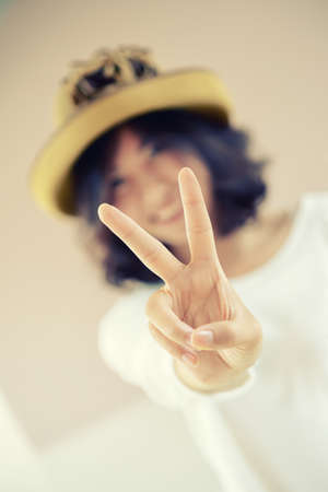 asia beautiful Girl Show Victory Signの写真素材