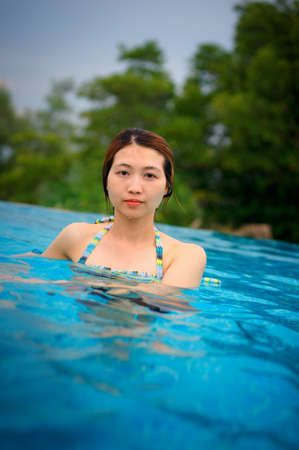 Young woman in the swimming poolの写真素材