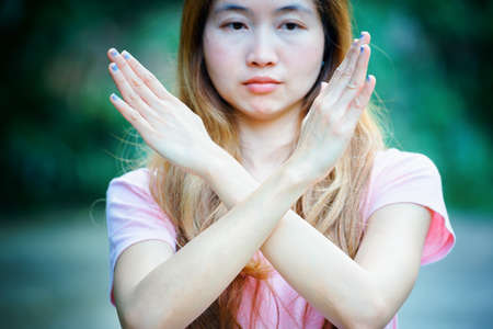 asia girl shows the hands stop timeout, women symbol conceptの写真素材