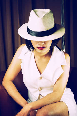 Portrait of beautiful young woman with white hat, , vintage effect