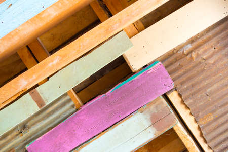 Rusty metal with colour wood for background and textureの写真素材