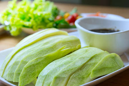 green mango with sweet fish sauce, thai style, food for health conceptの写真素材