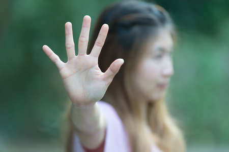 Asian women showing stop hand gesture,  focus handの写真素材