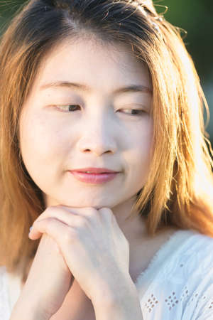 closeup of face and hand asia young woman, lifestyle conceptの写真素材