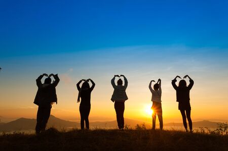 Landscape view of sunrise on misty  mountain hills with women and man silhouette, phatang mountain...