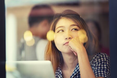 asia woman sitting at bar table on relax day , Vacations concept., vintage effectの写真素材