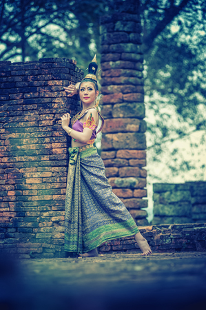 asai Woman In Thai traditional dress with old pagoda at Chiangsan Chiangrai Thailand, vintage effectの写真素材