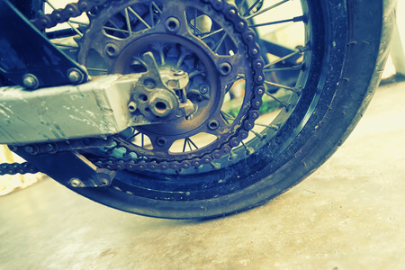 closeup shot of dirty motorbike chain.