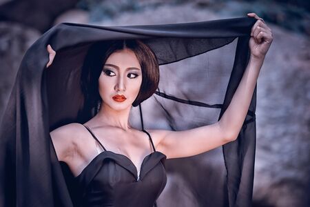 head shot fashion of asia elegant woman in black dressの写真素材