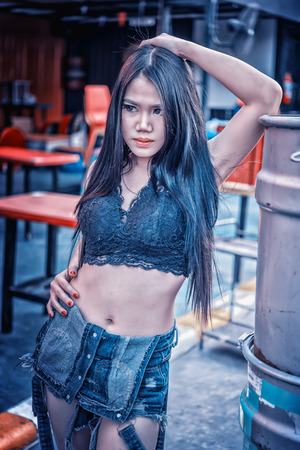portrait of Asia Sexy lady in black shirt and short jeans, vintage effectの写真素材