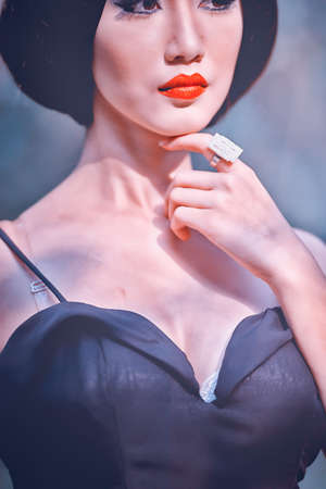 High fashion shot of asia elegant woman in black long dressの写真素材