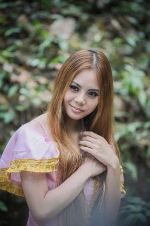 Portrait of asia beautiful girl in ballet dress on nature