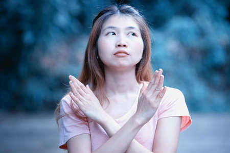 asia girl shows the hands stop timeout, women symbol concept