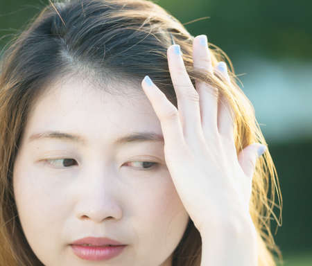 closeup of face and hand asia young woman, lifestyle concept