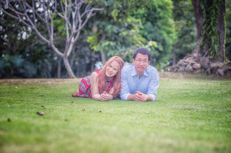 asia Young happy couple in the park on outdoor, love conceptの写真素材