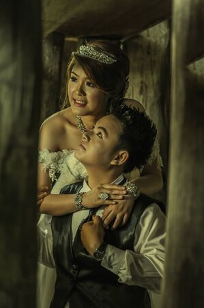 couple in love. portrait of asia young stylish fashion couple posing on outdoor. wedding styleの写真素材