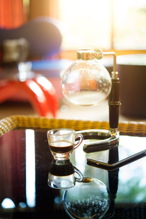 coffee cup and siphon vacuum coffee maker at shopの写真素材