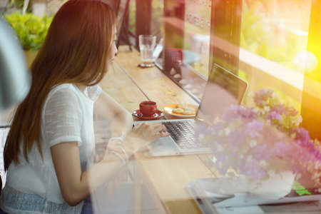 asia beuatiful woman Using Laptop In Coffee Shop