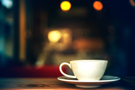 Coffee cup in coffee shop - vintage style effect pictureの写真素材