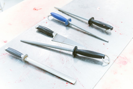 Set of kitchen knives for butcher in meat industryの写真素材