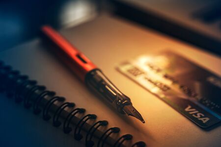 credit card and Pen on note book, close-up shot.の写真素材