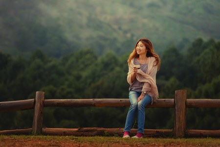 portrait of Asian tourists woman on view point at Tea garden doi angkhang Thailandの写真素材