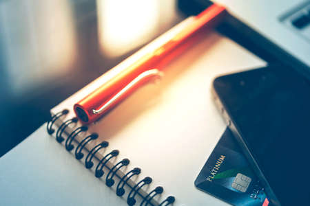 mobile phone, credit card and pen in morningの写真素材