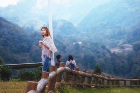 portrait of Asian tourists woman on view point at Tea garden doi angkhang Thailandの写真素材