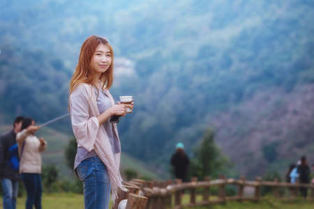 portrait of Asian tourists woman on view point at Tea garden doi angkhang Thailandの写真素材