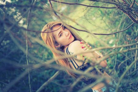 asia Sexy woman in summer fashion with black bra posing on nature, vintage effectの写真素材
