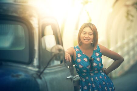 portrait of asia beautiful woman with vintage car