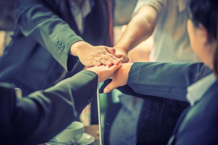 Business people coordinate hands in office. Concept Teamwork.