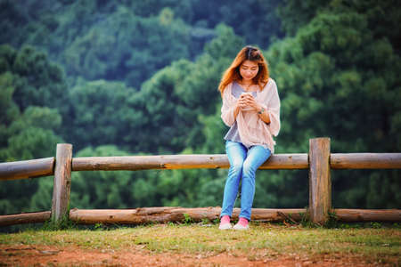 portrait of Asian tourists woman on view point at Tea garden doi angkhang Thailandの写真素材