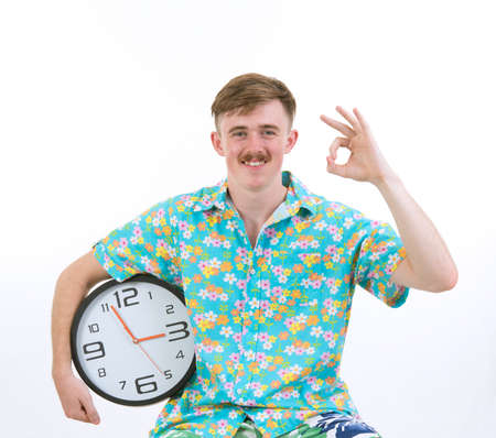 an attractive male in  colorful with clock posing on white backgroundの写真素材