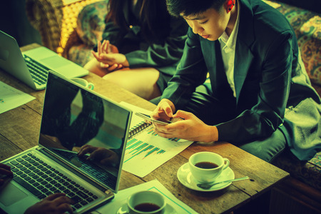 Group of business people brainstorming together in the meeting cafeの写真素材