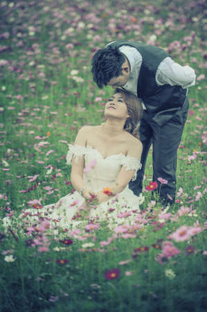 couple in love. portrait of asia young stylish fashion couple posing on outdoor. wedding styleの写真素材