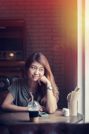 portrait of asia beautiful woman relax in coffee shopの写真素材