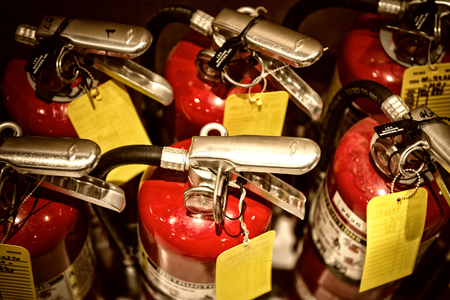 fire extinguishers available in fire emergencies on floorの写真素材