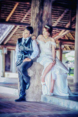 couple in love. portrait of asia young stylish fashion couple posing on outdoor. wedding styleの写真素材