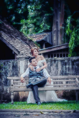 couple in love. portrait of asia young stylish fashion couple posing on outdoor. wedding styleの写真素材