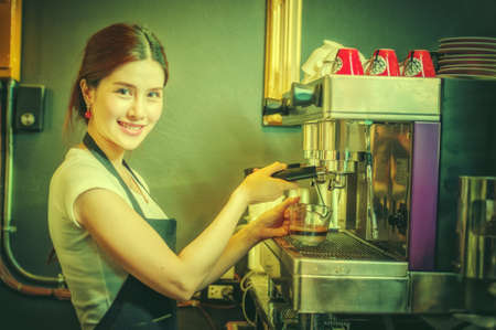 Coffee Business owner Concept - attractive young beautiful caucasian barista in coffee shopの写真素材