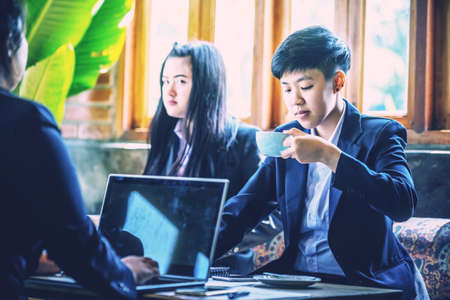Group of business people brainstorming together in the meeting cafeの写真素材