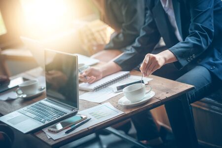 young Business people meeting in a cafe during coffee timeの写真素材