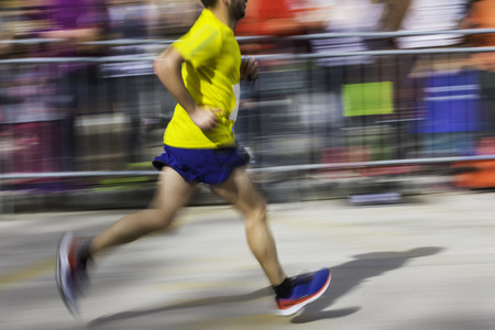 Motion blurred Marathon running people in the city